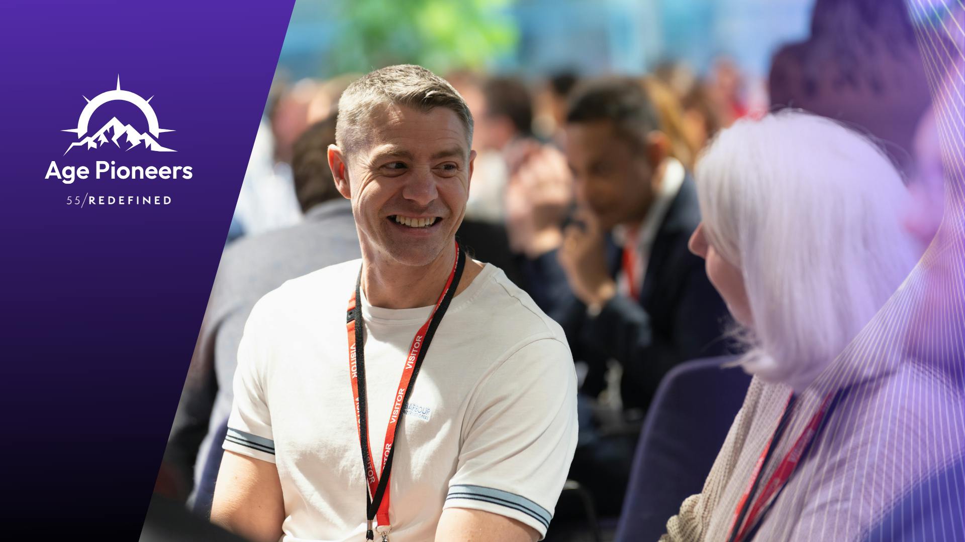 People smiling and networking at the Age Pioneers Summit