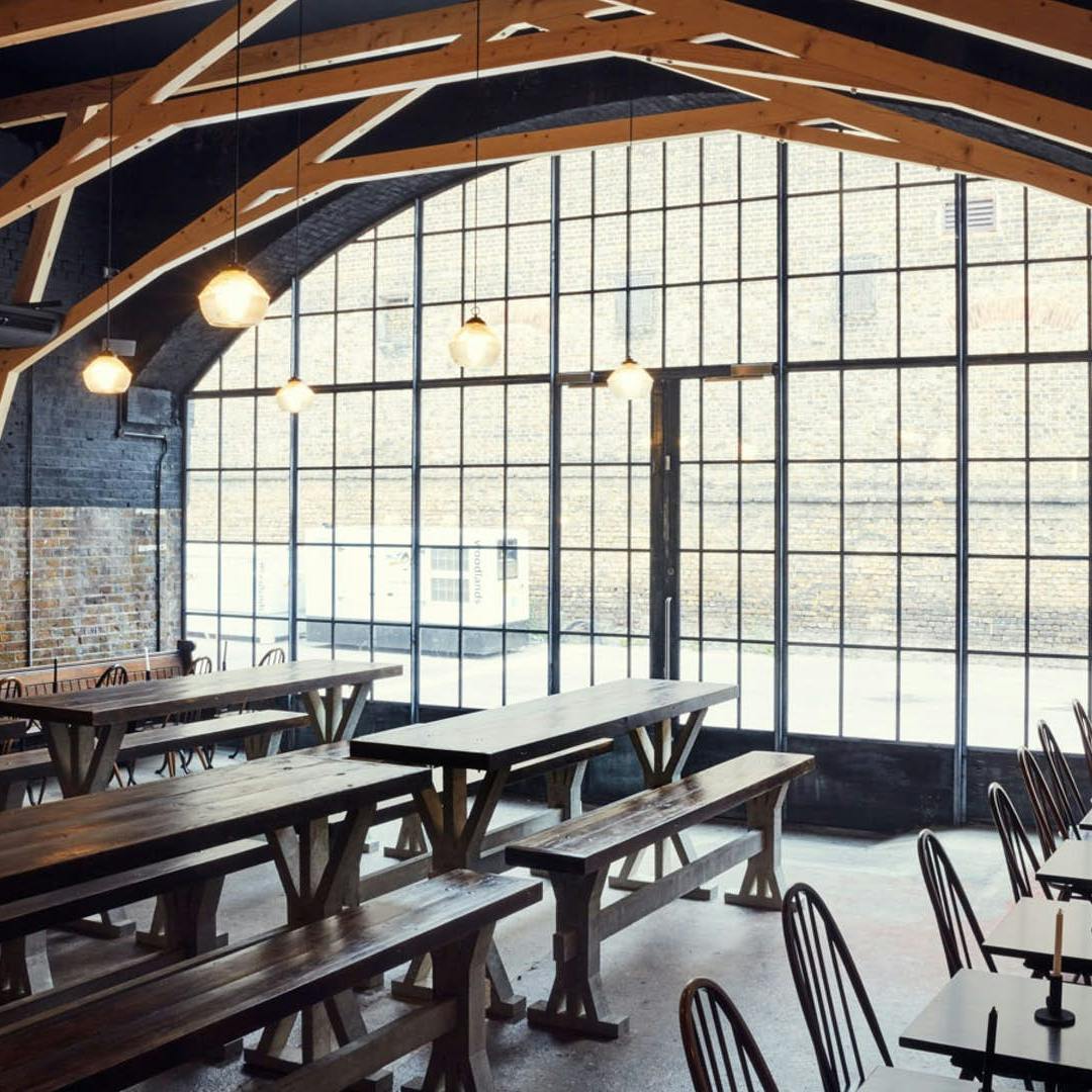 Vaulted room with benches at Hackney Church Brew Company